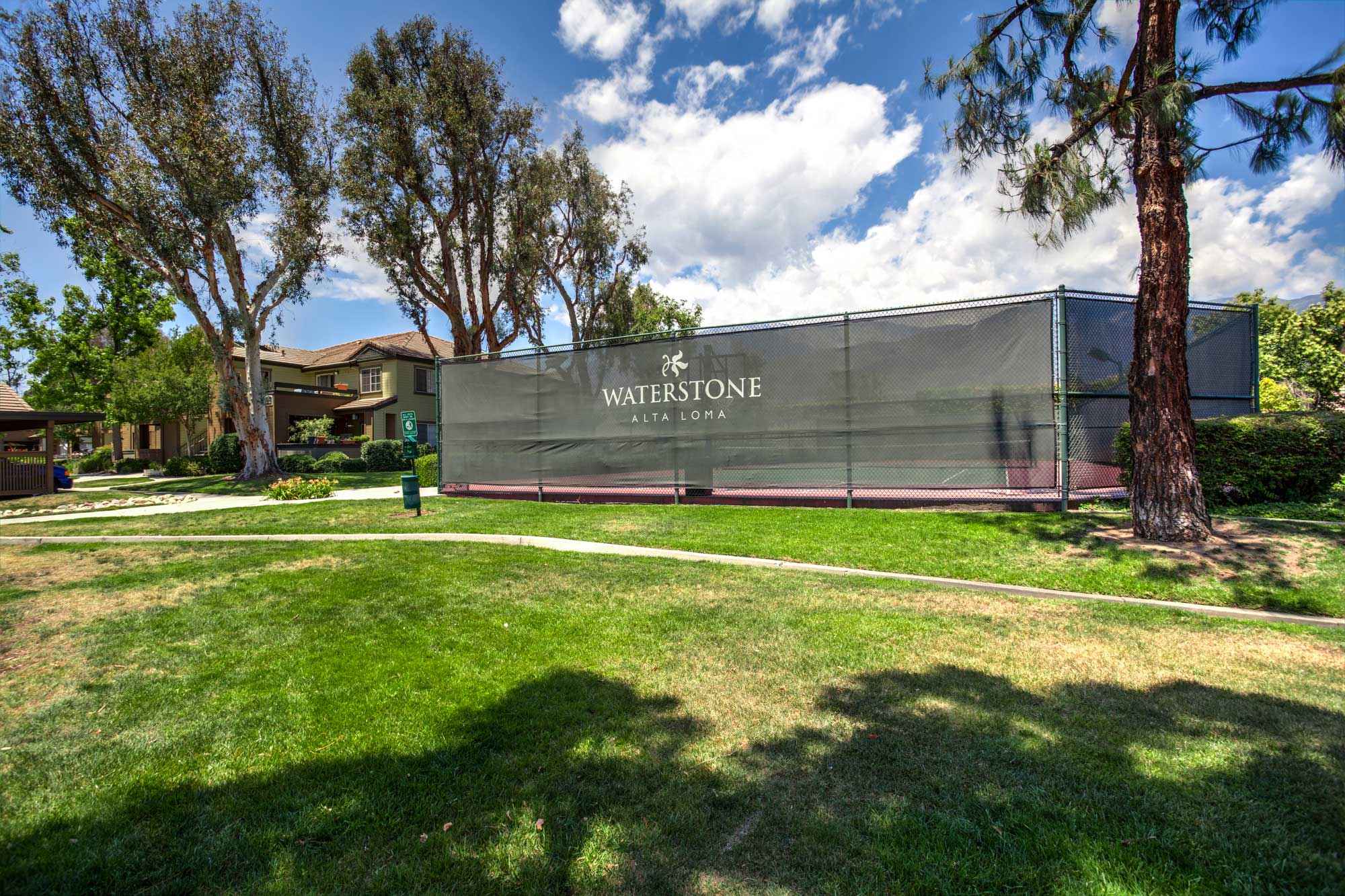 community gated tennis court at Waterstone